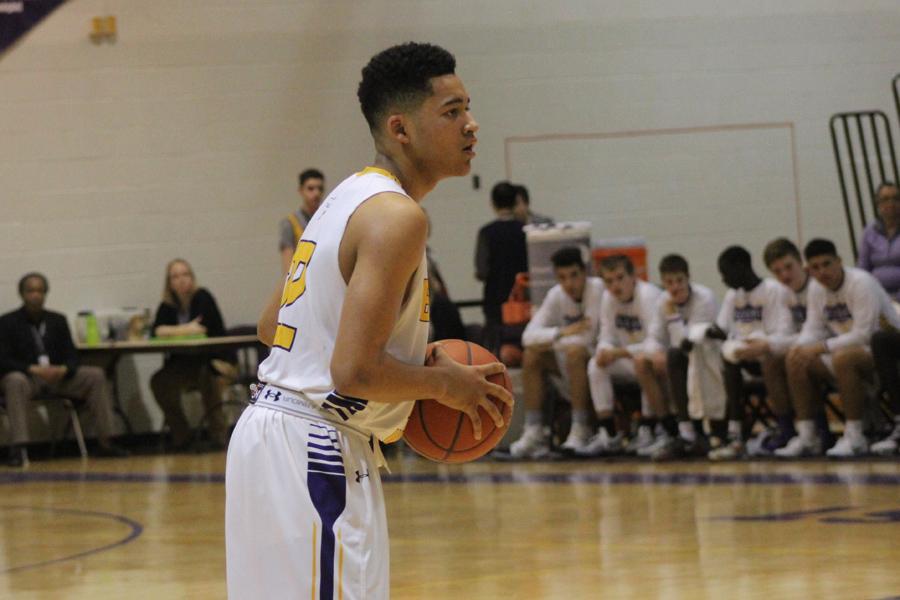 Sophomore Nico Felici sets up the play during the basketball game on Feb 10. The Bellevue West Thunderbirds took the win over the Fremont Tigers 59-42.
