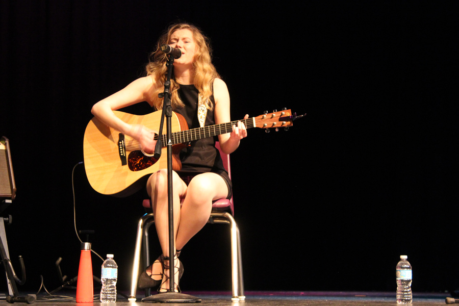 Senior Audrey Edris performs an original solo at the Songwriters Club's spring showcase.