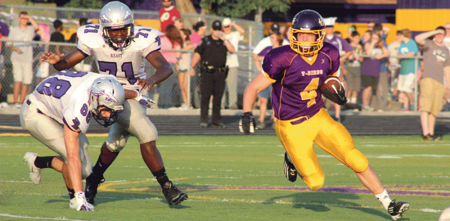 Running back senior Cole Patterson escapes the Chieftain defense at the annual East-West football game on Aug. 30, 2013. Patterson ended the night with 51 yard total on five carries.
Photo by Katie Begley