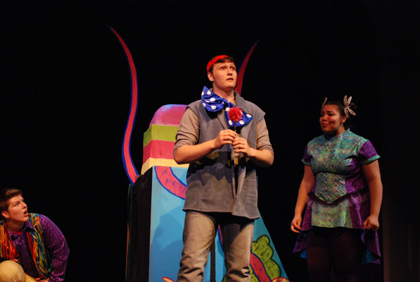 Students rehearse a scene from Seussical: The Musical. Senior Ian Mooney stars as Horton the Elephant, junior Lauren Johnson as Gertrude McFuzz, and senior Liam Tobey as one of the Wickersham brothers. Photo by Bryn Estlund.