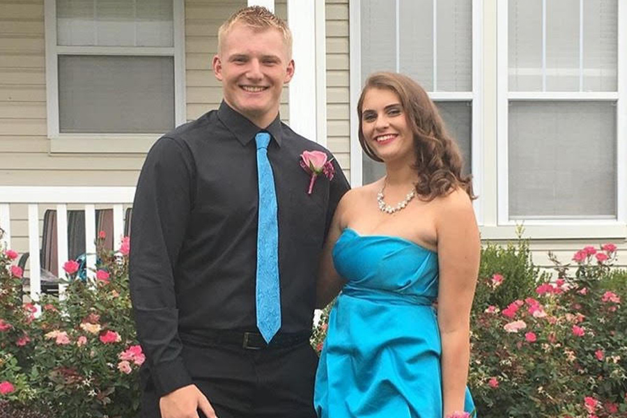 Juniors AJ Forbes and Rachel Nimmer pose for a picture before their homecoming dance.