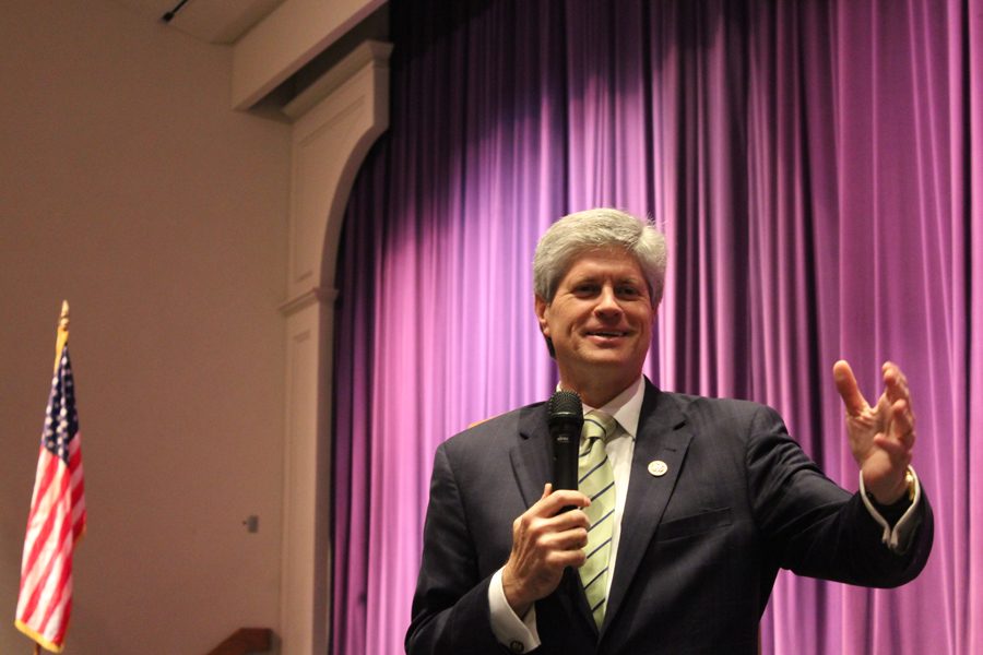 Nebraska Representative Jeff Fortenberry reaches out to the crowd of students gathered in the Bellevue West auditorium.