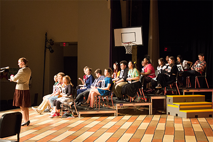 Students await their words in The 25th Annual Putnam County Spelling Bee in March 2017.