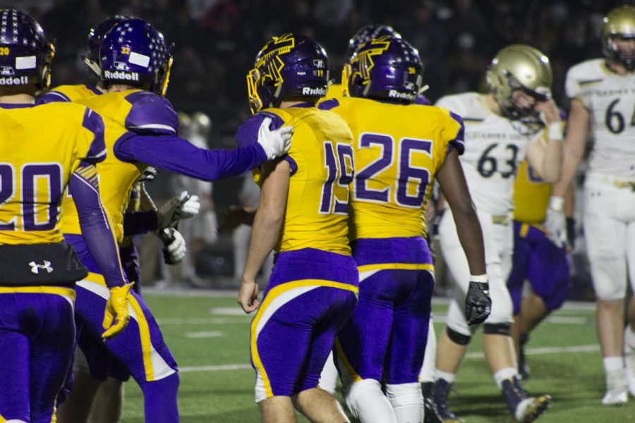Defensive players head back to the line after a play in the State Quarterfinal on Nov. 2, 2018.