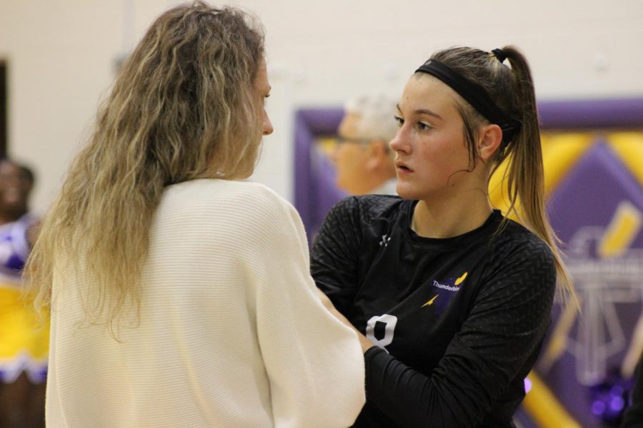 Lets Talk. Coach, Christina Krajieck talks one-on-one to setter, sophomore Jayna Hope before hopping back into the game.