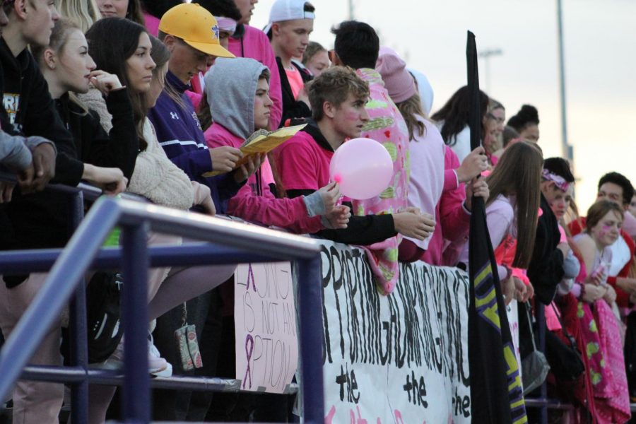 Students in the Flock Squad wait for the Thunderbird football team to face the Omaha North Vikings on Oct. 17.
