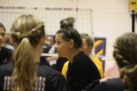 Volleyball Coach Christina Krajicek talks to the team during a timeout.