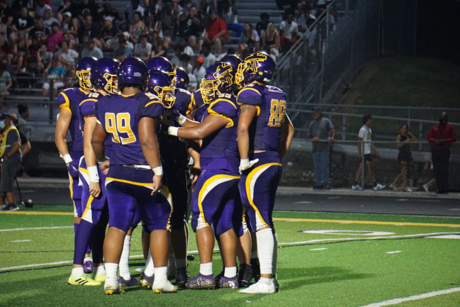 The Bellevue West offense strategizes during the Burke game on Aug. 26, 2021. 