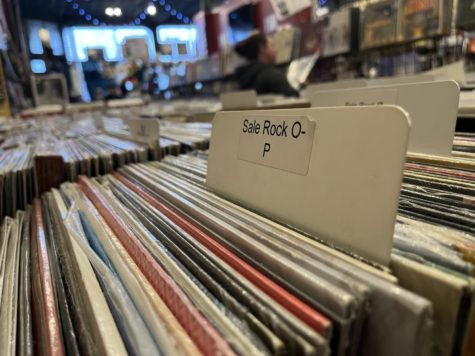 Homer’s Record Store displays sale on rock genre vinyl records O-P