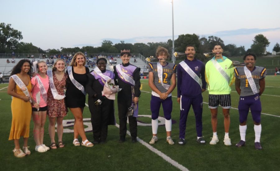  The homecoming court stands together at the homecoming football game.  