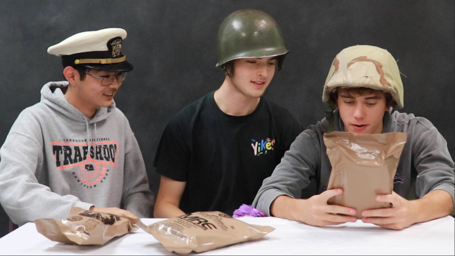 Lucas Pechacek and friends try out Meal Ready to Eats (MRE)