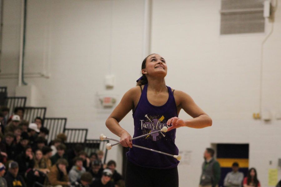 Sophomore Jayda Turner watches her baton in the air.
