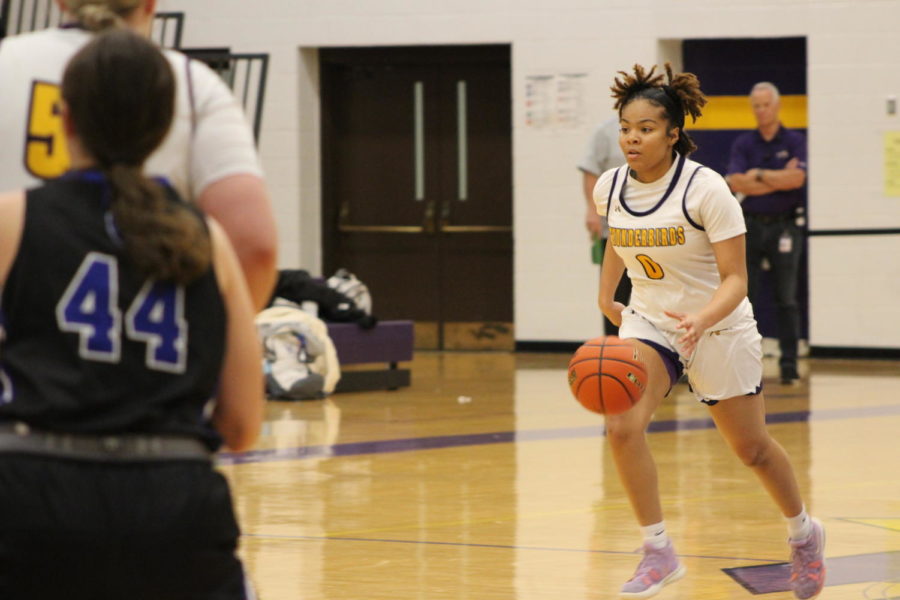 Junior Ahnica Russell-Brown dribbles down the court.