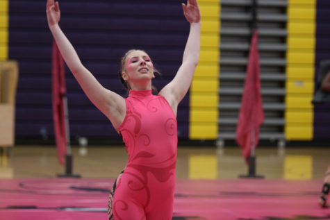Junior Alaina Jenkins strikes a pose during the show.
