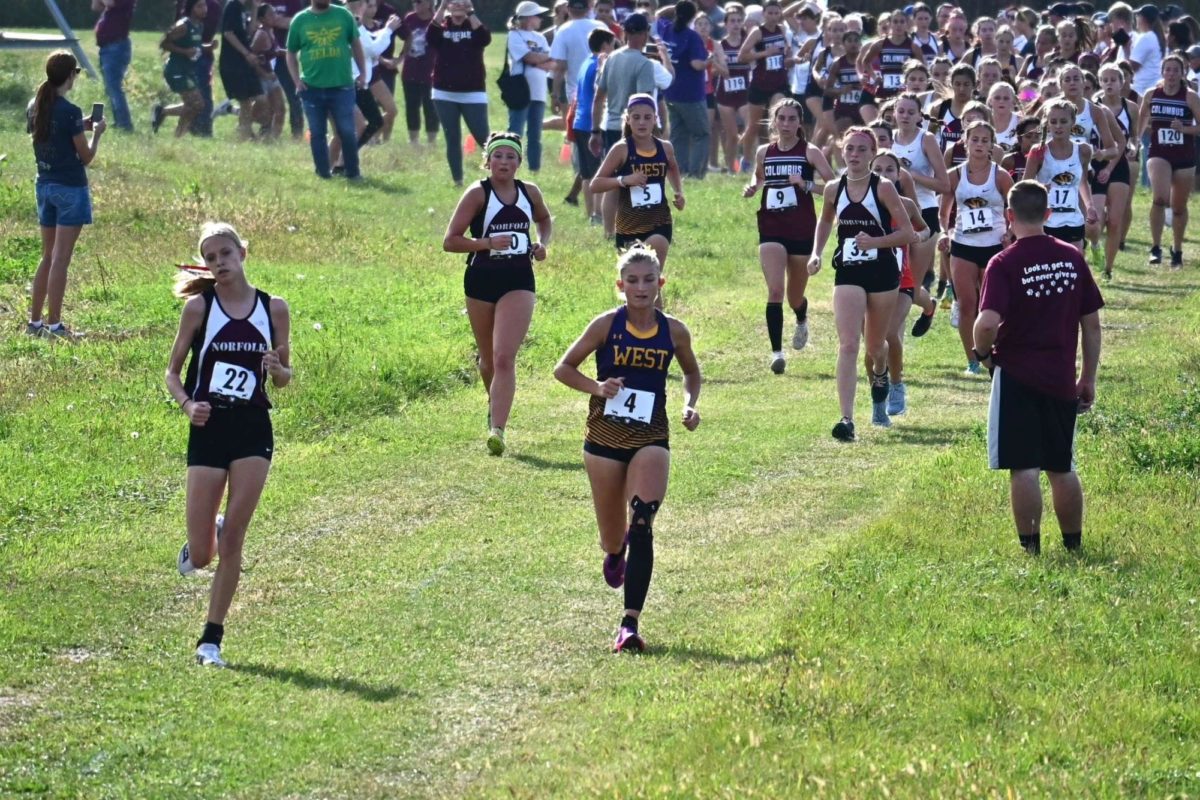 Senior Kara Muller leads a group of runners at a cross country meet in Columbus, NE.