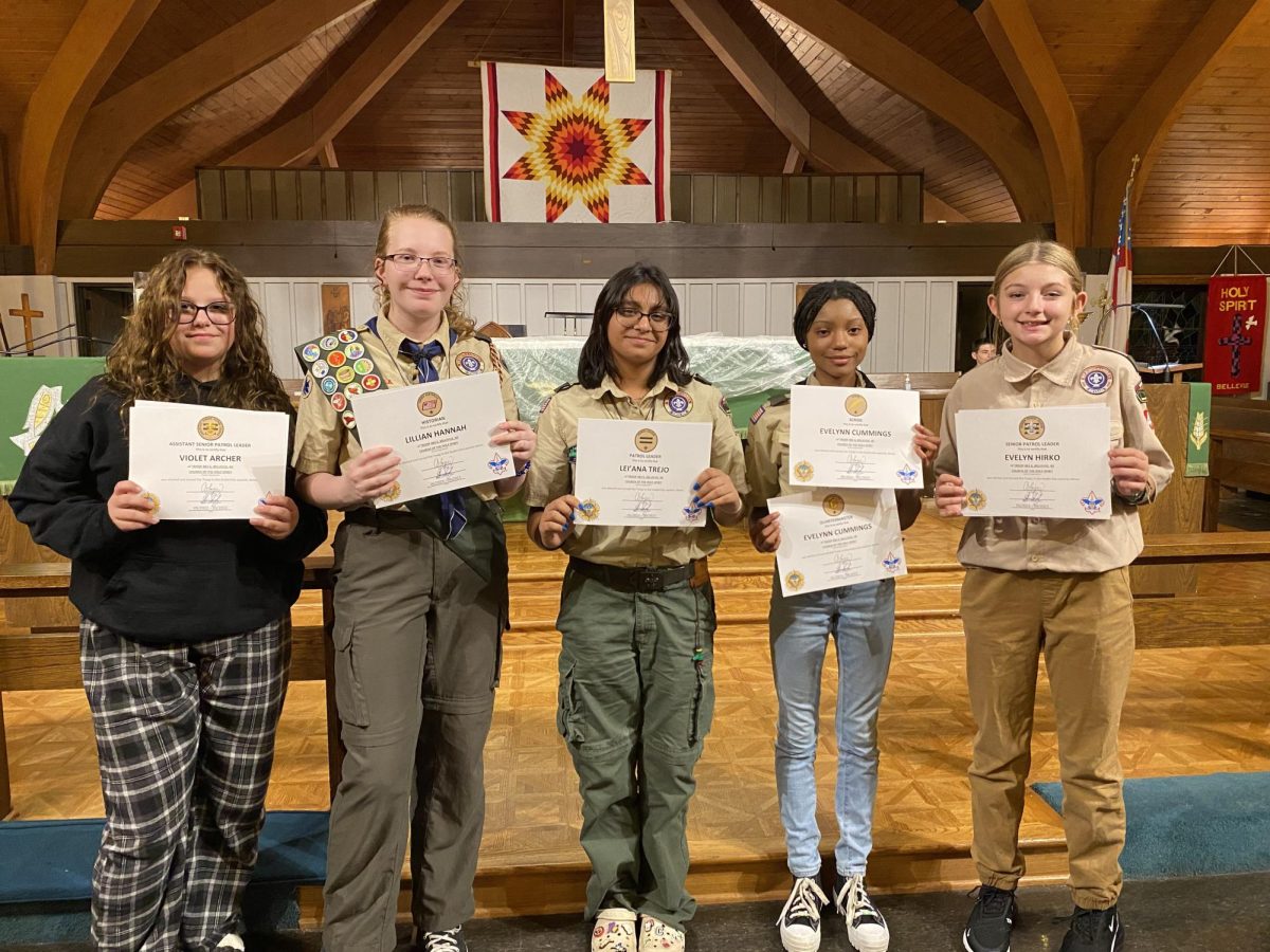 Pictured left to right: Violet Archer, Lillian Hannah, Lei’Ana Trejo, Evelynn Cummings, and Evelyn Hirko receive acknowledgement awards for serving important positions within their troop.
