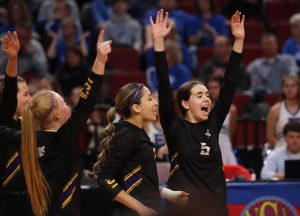 Junior Madison Emery celebrates with her teammates in the NSAA State Volleyball quarterfinals on Nov. 1.