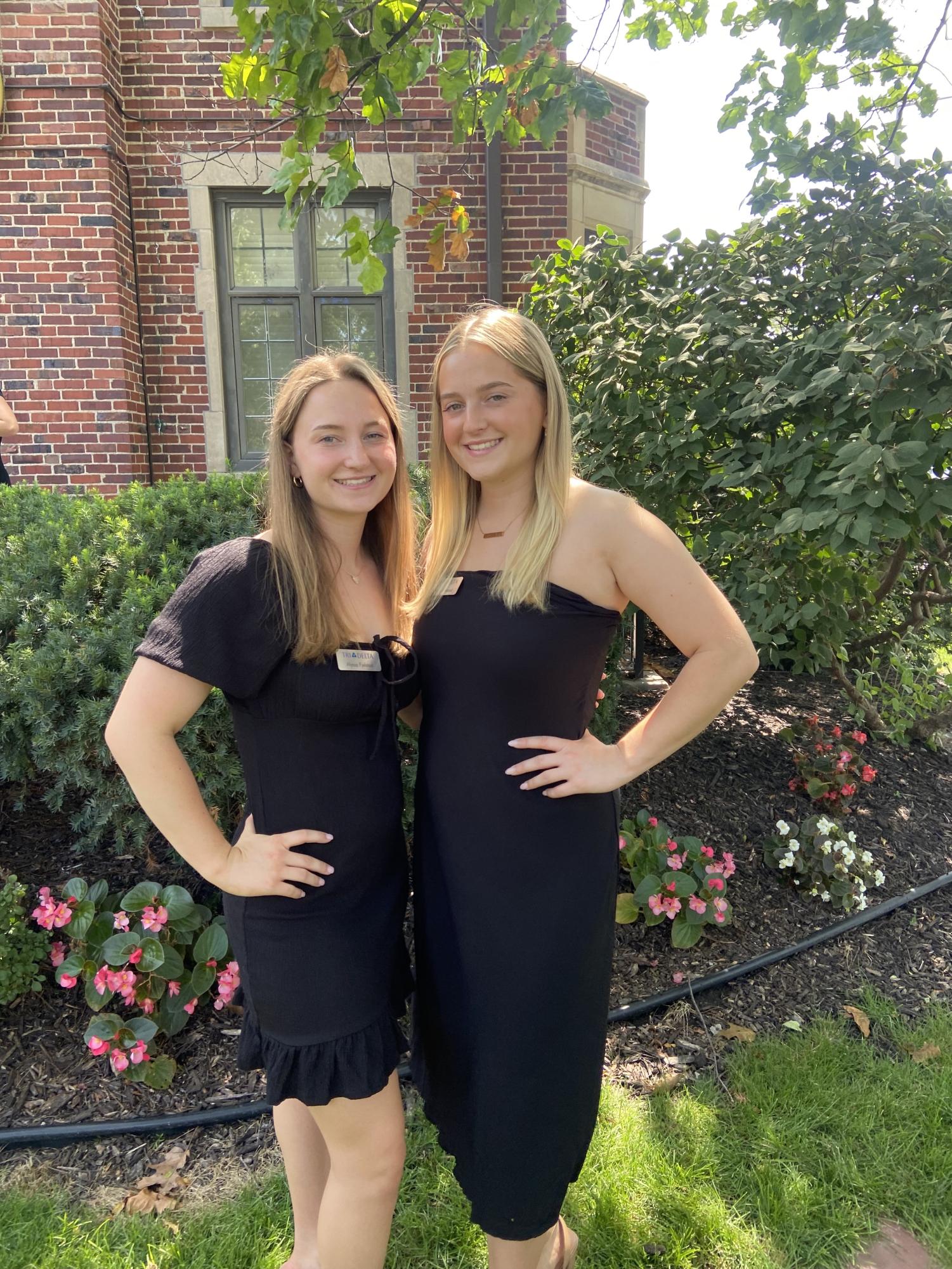 2022 alumnae Alyssa Fjelstad and her sister Katelyn Fjelstad pose in front of their sorority Delta Delta Delta. Photo provided by Alyssa Fjelstad.