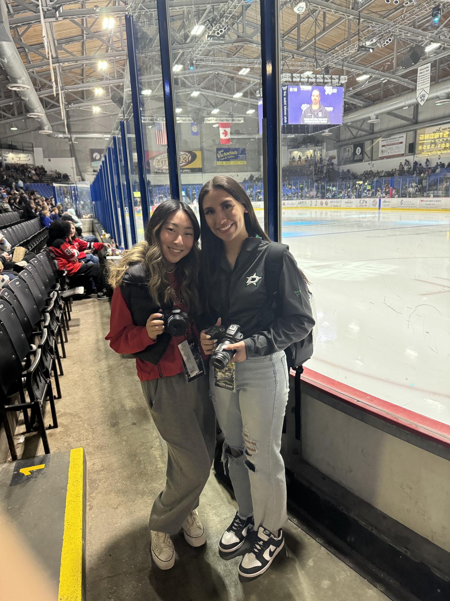 2022 alum Grace Pechacek takes photos at a Lincoln Stars hockey game for her UNLimited Sports class. Photo provided by Grace Pechacek.