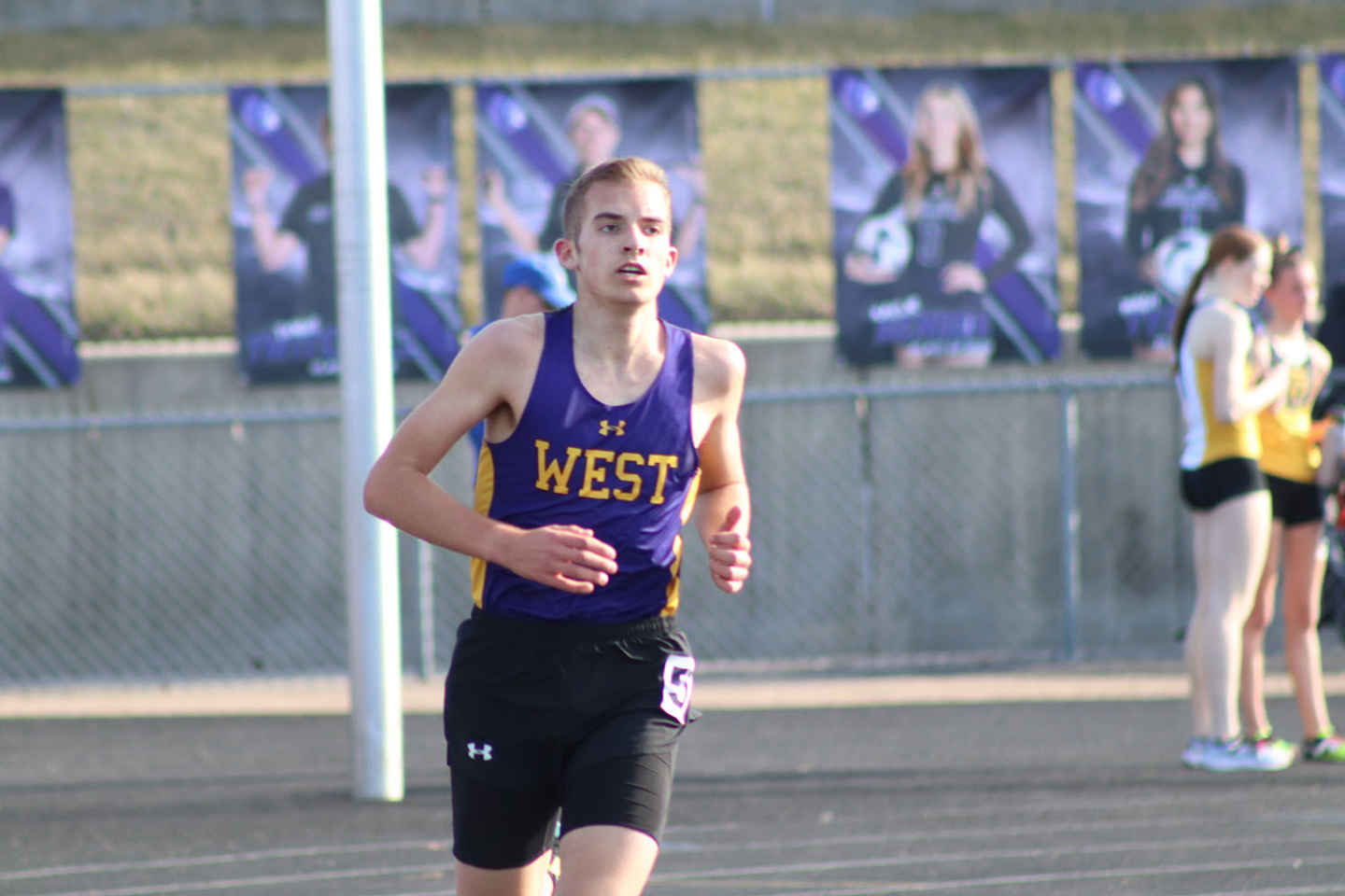 Senior Grant Schaefer runs at a track meet at Bellevue East High School on March 28.