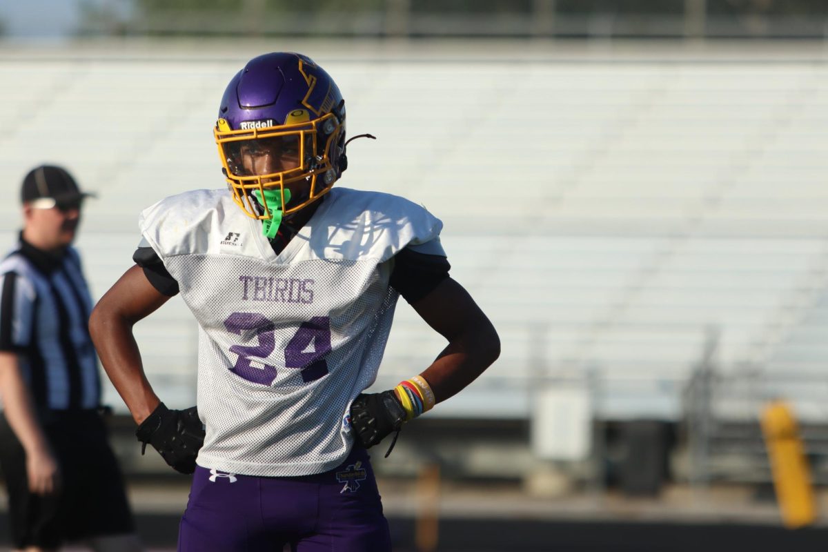 Sophomore Josiah Wardlow looks at his coach while he waits for the next play call.