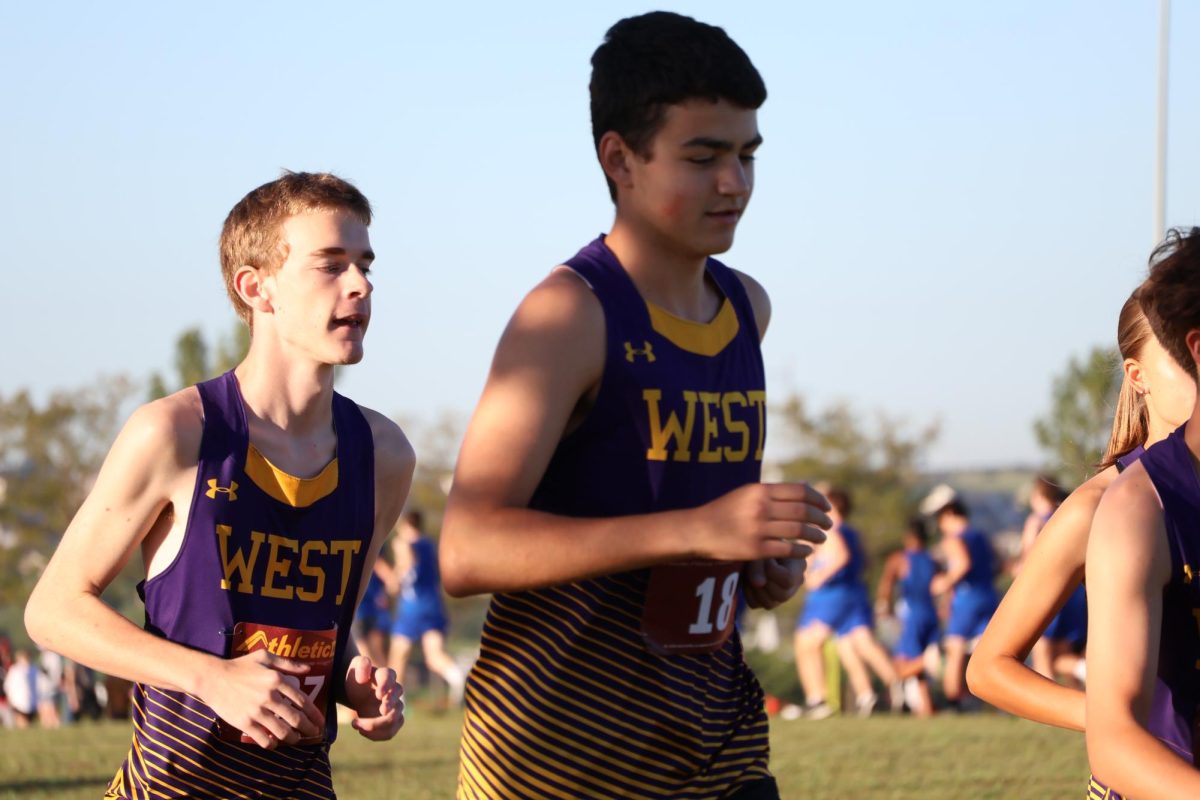 Sophomore Judson Gregory smiles down as he trots back to his team and coaches.