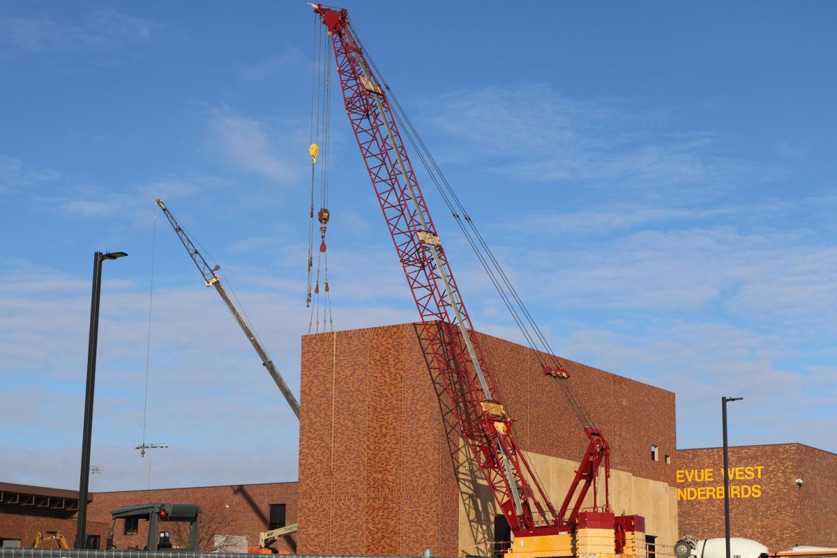 A crane adds more walls to the new auditorium on Dec. 18, 2024.