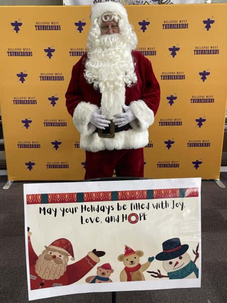 Santa Claus takes a break from what is surely a very busy time of year for him, to visit students and staff at West and admire their ugly sweaters.