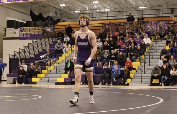 Senior Creighton Jongling walks off the matt after his match.