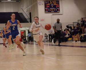 Vanna Reitsma dribbles down the court against Kearney.