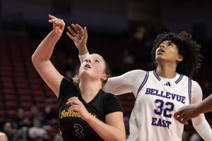 Sophomore Jaycee Woodard watches the ball after shooting it. 