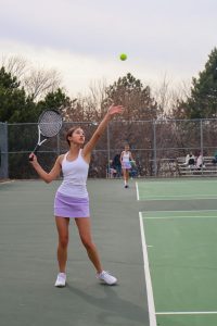 TOSS. Sophomore Gabriela Suarez tosses the ball to serve.