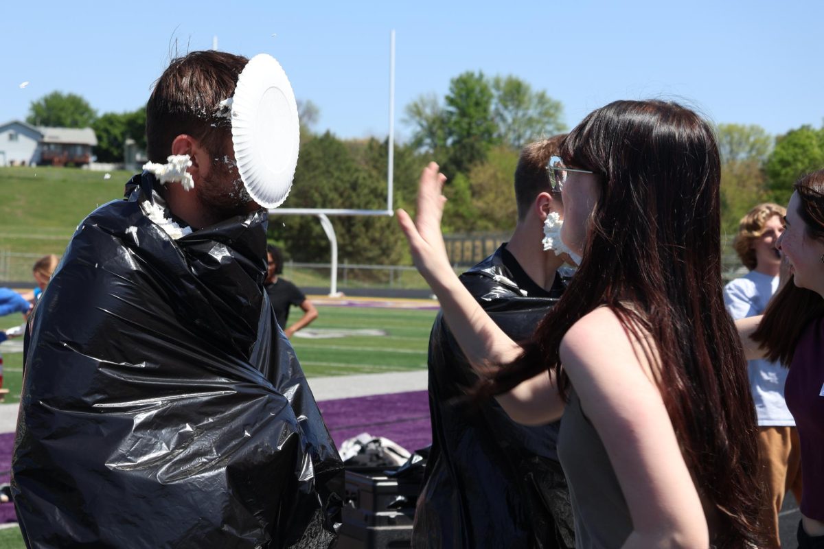 Science teacher Charles Rosenthal receives a pie in the face from Julianna Bryan on May 5, 2025. 
