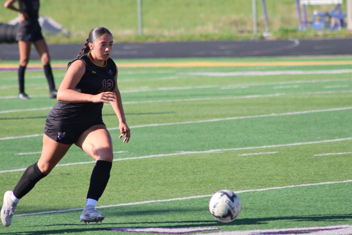 Ashley Ramirez takes the ball downfield.