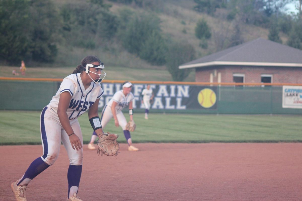 The softball team prepares for the hit.