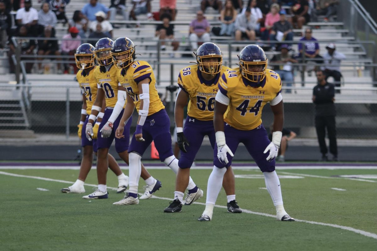 Bellevue West Football players line up to prepare for kickoff. 