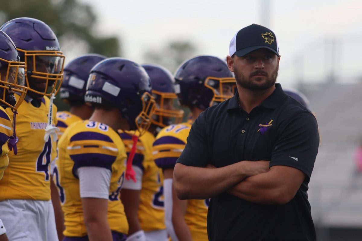 Coach Jake Gentile gets ready before the game.