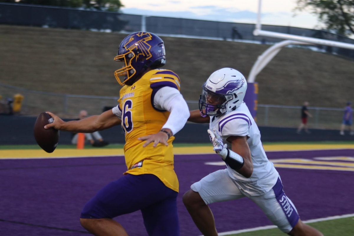 Senior Will Anderson dodges the tackle to score a touchdown.