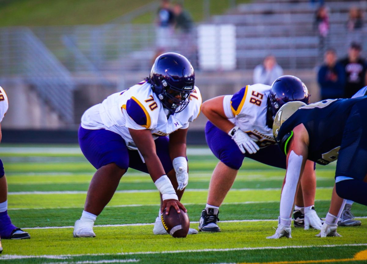 Senior Josiah Reed is ready to snap the ball.