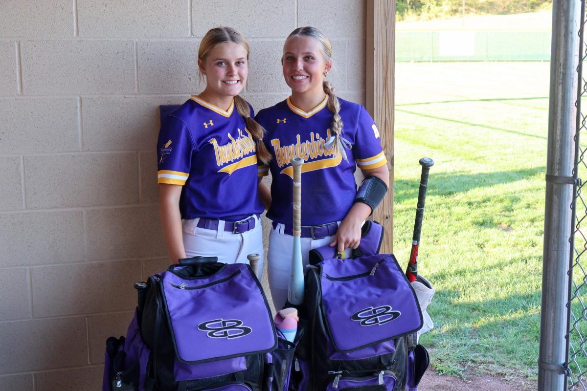 Softball team unloads their baggage