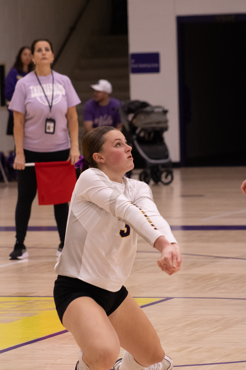 Junior libero Teagan Glomb passes the ball during the game vs. Omaha Westview on Sept. 4.