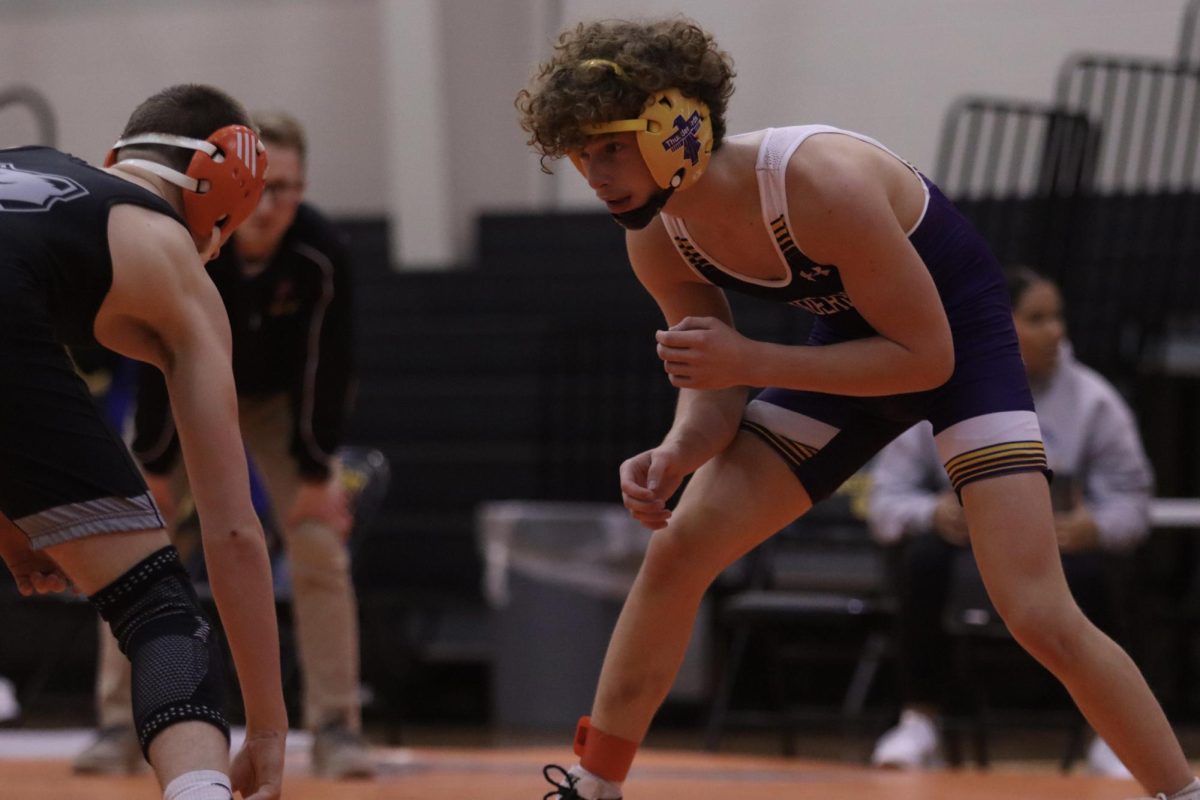 Anticipation. Junior BRYCE WALTER prepares to wrestle.