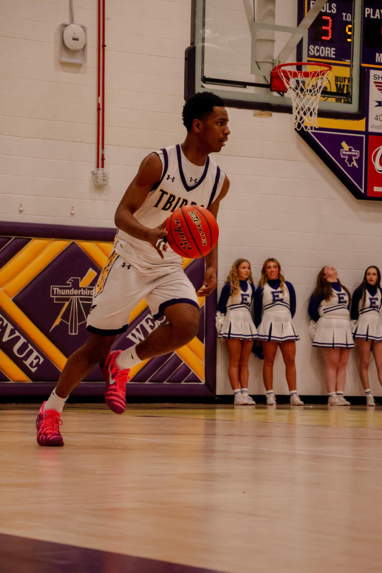 Dribble. Junior Bryce Johnson brings the ball up the floor before the team’s offensive possession. 