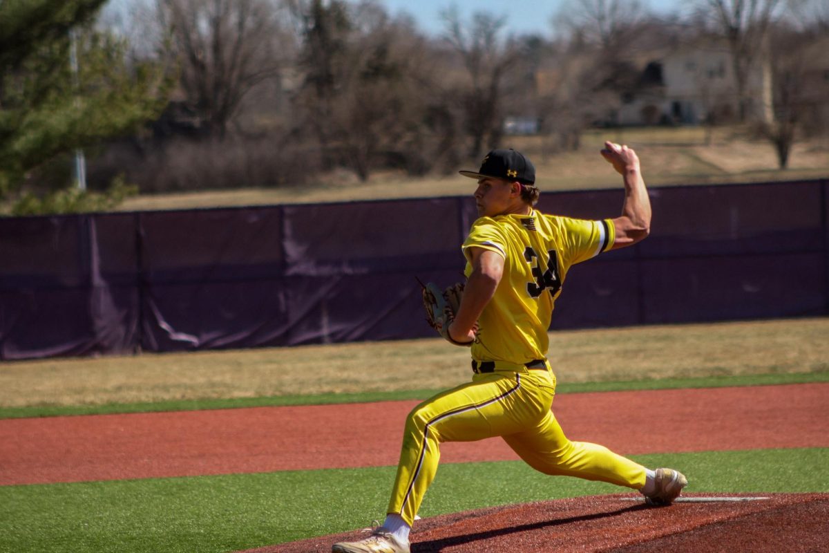 THROW. Sophomore Jett Havlat throws a pitch.