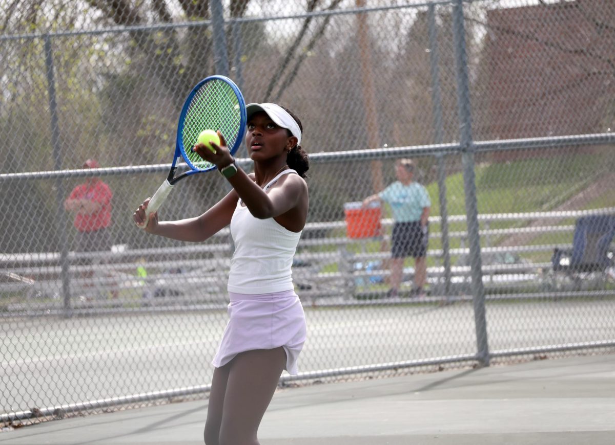 Sophomore Hope Keith focuses as she serves.