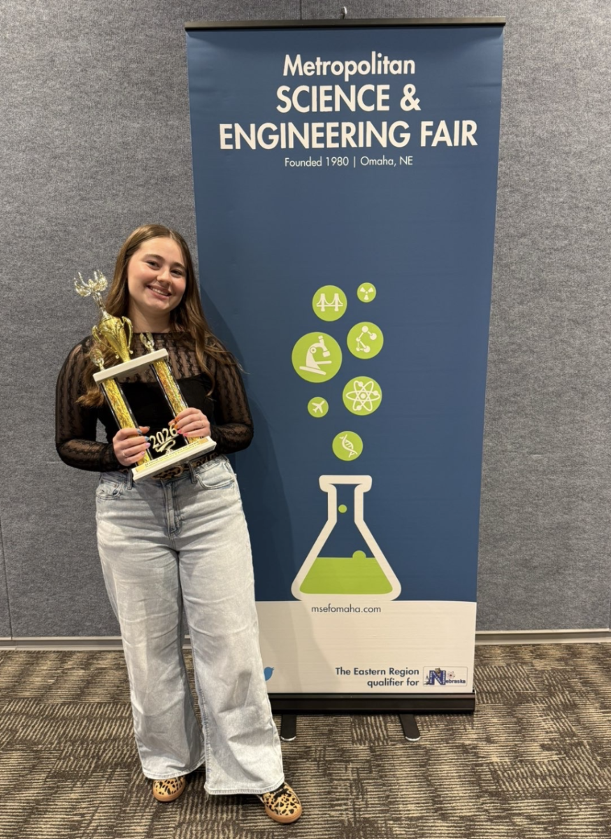 Senior Madeleine Blakely holds the Dow Award at the Metropolitan Science and Engineering Fair. Photo provided by Alex Cicero.