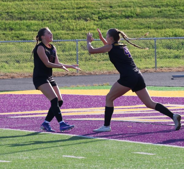Senior Zoe Ryan and sophomore Yirah Sears celebrate after a goal.