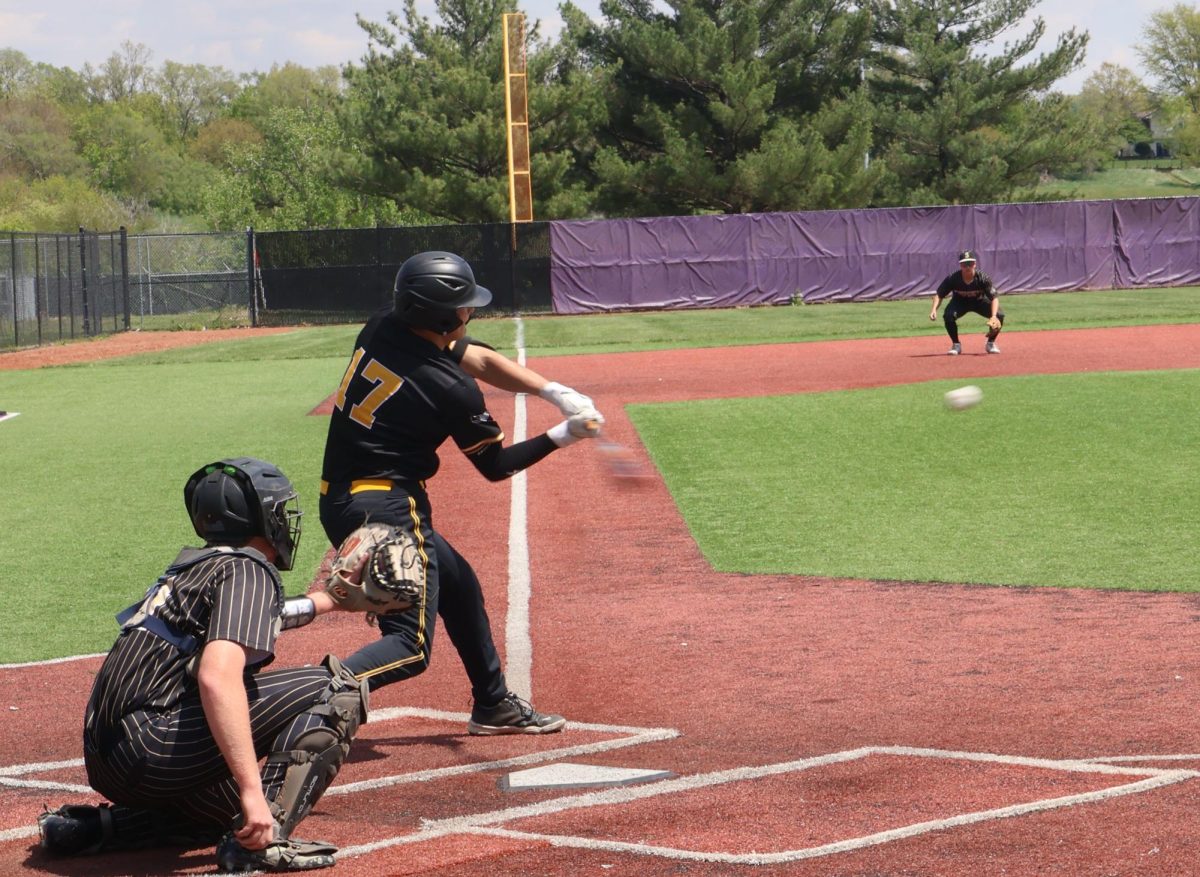 Junior Barret Valasek strikes the ball.
