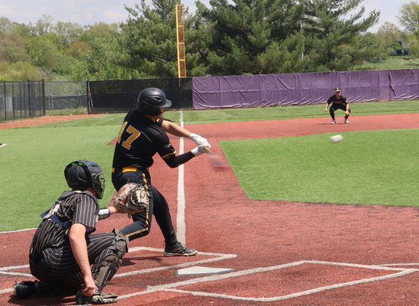 Junior Barret Valasek strikes the ball.