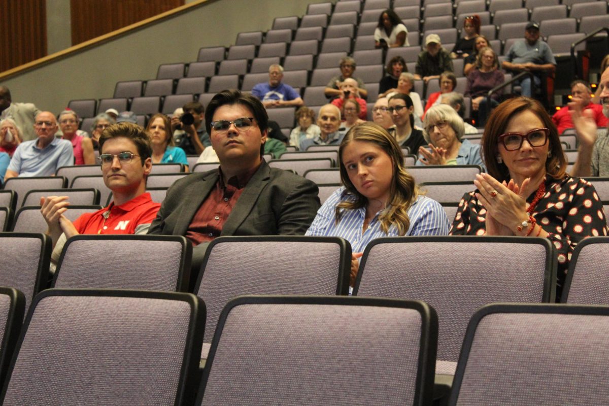 Nebraska residents clap in response to Mike Flood.